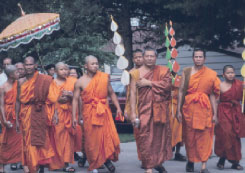 Image of Buddhist monks as they process at the Wat Lao in Des Moines